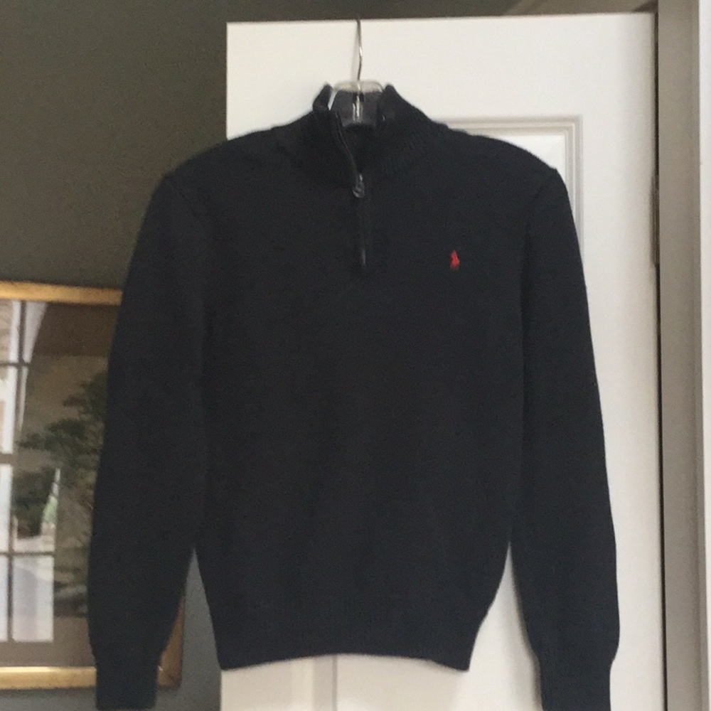Kid’s navy Polo sweater.